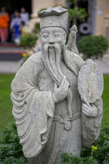 Stone statue of a Chinese warrior, guardian, Wat Phra Kaew, Temple of the Emerald Buddha, Bangkok,