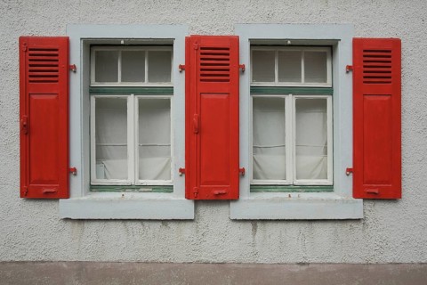 House façade with two windows and three red shutters, white, Kronberg, Taunus, Hesse, Germany