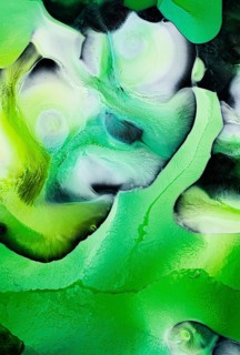 Vivid green liquids art with swirling patterns and dynamic textures. This abstract piece features