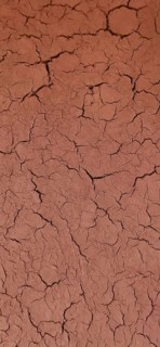 Close-up of dry, cracked soil in brown color, desert soil, Morocco
