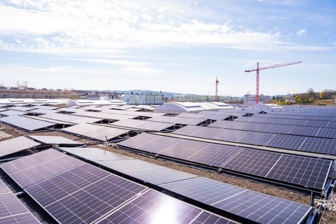 Solar systems with a crane in the background, integration of sustainable energy and urban