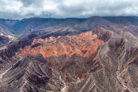 Breathtaking aerial view of the Hill of Seven Colors in Purmamarca, Argentina, showcasing vibrant