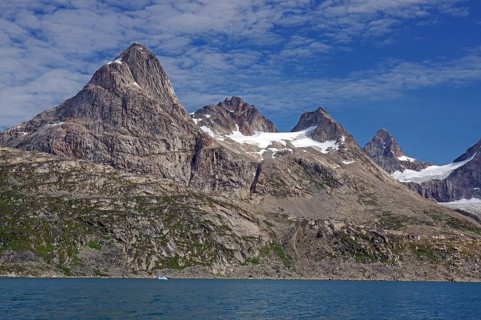 Numerous rugged peaks rise high above a rocky coastline, Tasilaq, Arctic, Greenland, Denmark