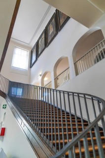 Classic staircase in a building, decorated with framed works of art, Kirchheim Teck, Germany