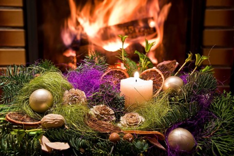 Christmas floral table decoration in front of the fireplace