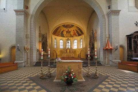 Altar with candles and decoration, interior view, chancel, Romanesque Basilica of St. Castor,