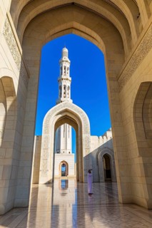Arched gates and minaret of the Sultan Qaboos Mosque, Muscat, Arabian Peninsula, Sultanate of Oman