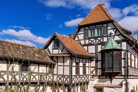 Traditional half-timbered houses under a clear blue sky, Wartburg Castle near Eisenach in Thuringia