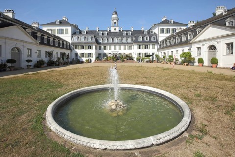 Baroque Rumpenheim Palace with fountain in round water basin, landmark, Rumpenheim, Offenbach am