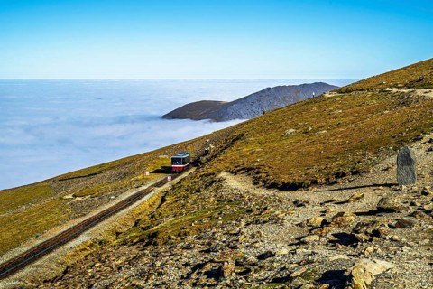 Train on Snowdon Massif, Snowdon Range, Snowdonia, North Wales, UK