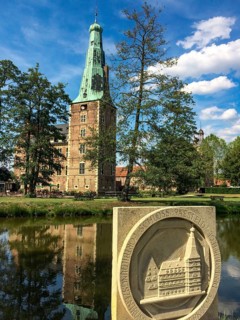 Raesfeld moated castle, stone tablet with half relief in the foreground, moat in between, Raesfeld,
