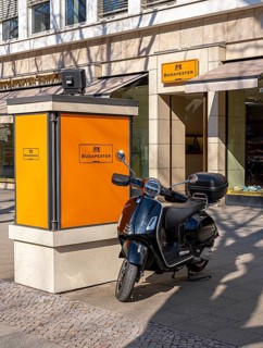 The typical and partly historic display cases for advertising along Boulevard Kurfürstendamm,