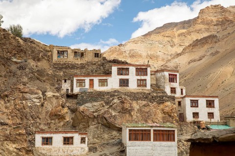 Traditional houses nestled amidst the rugged, mountainous terrain of Zanskar Valley in Ladakh,