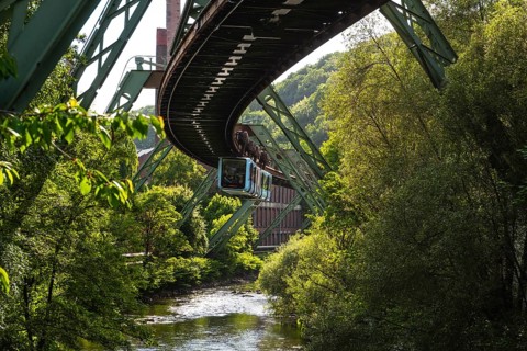 A suspension railway over the riverbed of the Wupper near the Völklinger Straße stop in Wuppertal,