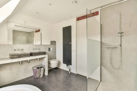 Stylish modern bathroom featuring sleek fixtures, minimalist decor, and elegant tiling for a