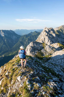 Hiker on a ridge in the mountains, Schaffauer, Wilder Kaiser, Tyrol, Austria