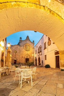 Ostuni Cathedral square seen through the Arco Scoppa archway, Apulia, Puglia, Italy