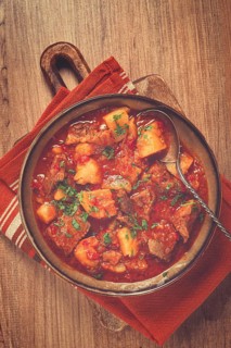 Potatoes with meat, stewed in tomato sauce, with spices and herbs, homemade, no people