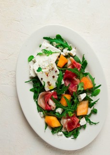 Salad, melon with prosciutto, arugula, and cheese, summer salad, vegetarian, homemade, no people
