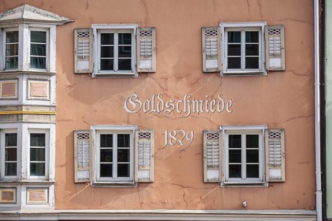 Detailed view of a traditional Bügerhaus with window and shutters, filling the format, in the