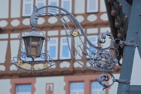 Nose sign with lantern from Luther House, home of Martin Luther, inscription, half-timbered house,