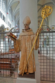 Saint Bernard of Clairvaux with Bible and golden episcopal staff, 17th century wooden sculpture,