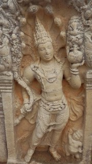 Stone relief, watchstone, muragala of an ancient figure, richly decorated and traditionally