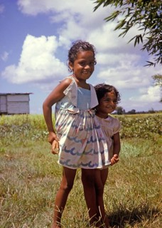 Two smiling little girls new citizens of newly independent Trinidad and Tobago c 1962