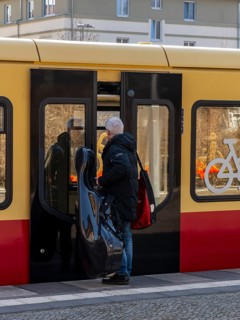 S-Bahn platform with passengers and the historic structures at Lichterfelde West station, Berlin,