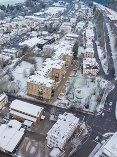 Cityscape with snow-covered buildings and streets in a winter setting, Nagold, Black Forest,