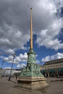 Historic column on a large square under cloudy sky, Hamburg, Germany