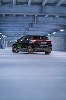 Black car from behind in an empty car park at night, e-car sharing, Deer Mobility, MG4, Calw,
