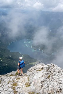 Mountaineer at Waxenstein with fog, Eibsee lake, Wetterstein Mountains, Garmisch-Patenkirchen,