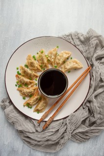 Japanese Gyoza dumplings, fried, with sauce, top view, without people, tinted, selective focus