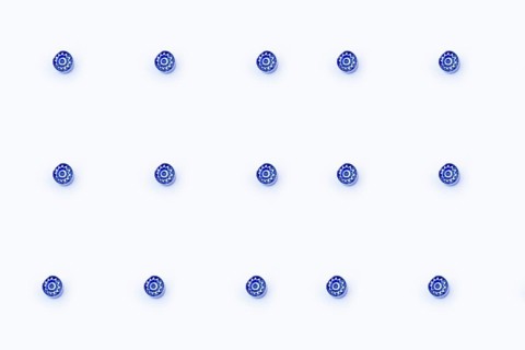 A minimalist image showing thirteen small blue Murano glass marbles arranged in a grid on a crisp