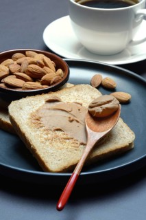 Toast with almond cream and almond shell, spread