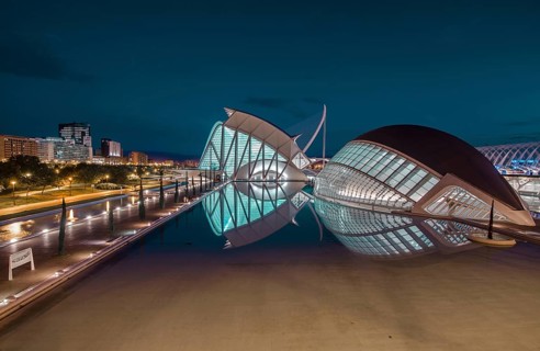 The City of Arts and Sciences in Valencia, Spain, illuminated at night. Its futuristic architecture