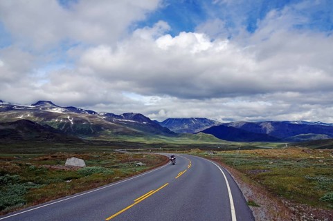 A motorcyclist rides on a mountain, Valdresflyra, Norway