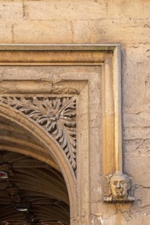 Head carved in stone, portrait, passageway, Bodleian Library, courtyard, Old Schools Quadrangle,