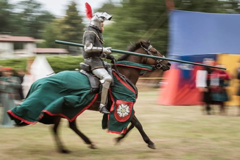 LUBIAZ, POLAND - AUGUST 25, 2018: Monastery Siege - historical staging. Knights horse riding show