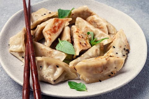 Japanese fried dumplings, gyoza, sesame seeds, top view, no people