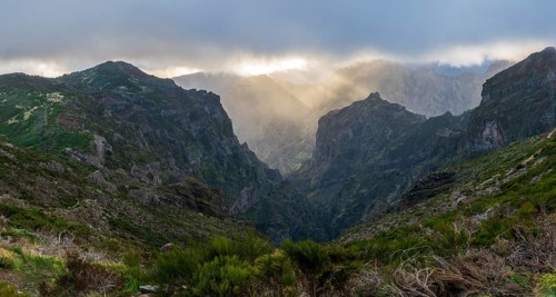 Sunset at Pico do Arieiro, sun shining through clouds, sunbeam, hiking trail PR1, Madeira, Portugal