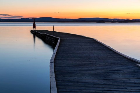 Long boat dock at dusk on Lake Siljan near Nusnäs, Dalarnas län, Sweden