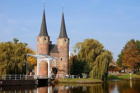 Oostpoort city gate and drawbridge on the Delftse Schie, Delft, South Holland, Netherlands