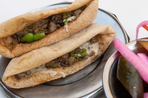 A plate of tasty fried liver and spicy green pepper sandwiches, one of the most popular street food