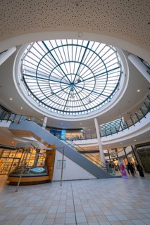 Interior of a shopping centre with a large glass roof and modern architecture, Sterncenter