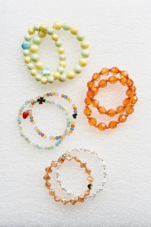 Collection of handmade bracelets crafted with colorful beads. These vibrant accessories showcase