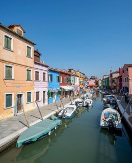 Colourful houses on the canal with reflection, Canal with boats and colourful house facades, Burano