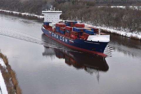 Container ship AURORA sails in winter in the Kiel Canal, NOK, Kiel Canal, Kiel Canal,