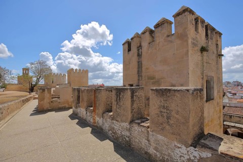 Alcazaba with Torre de lo Caballeros, historic city fortifications and defensive defence tower with